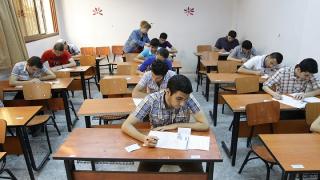 Syrian students sit their end of year exams at a high school in the capital Damascus, on June 18, 2013. Across Syria students are sitting their exams at sate-run schools, after which, if successful, they will continue their education at a university. AFP PHOTO / LOUAI BESHARA (Photo credit should read LOUAI BESHARA/AFP via Getty Images)